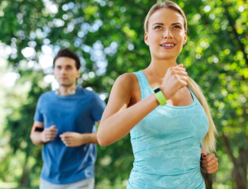 couple doing morning exercise in park under the tree