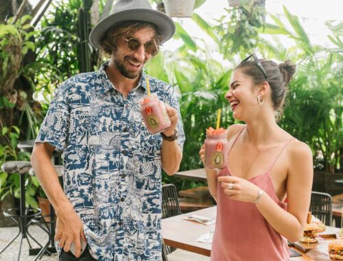 couple enjoying mix frouit smoothies in summer