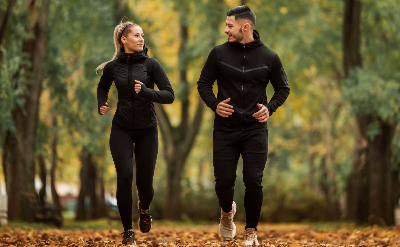 healthy and fit couple doing morning running exercises in the park