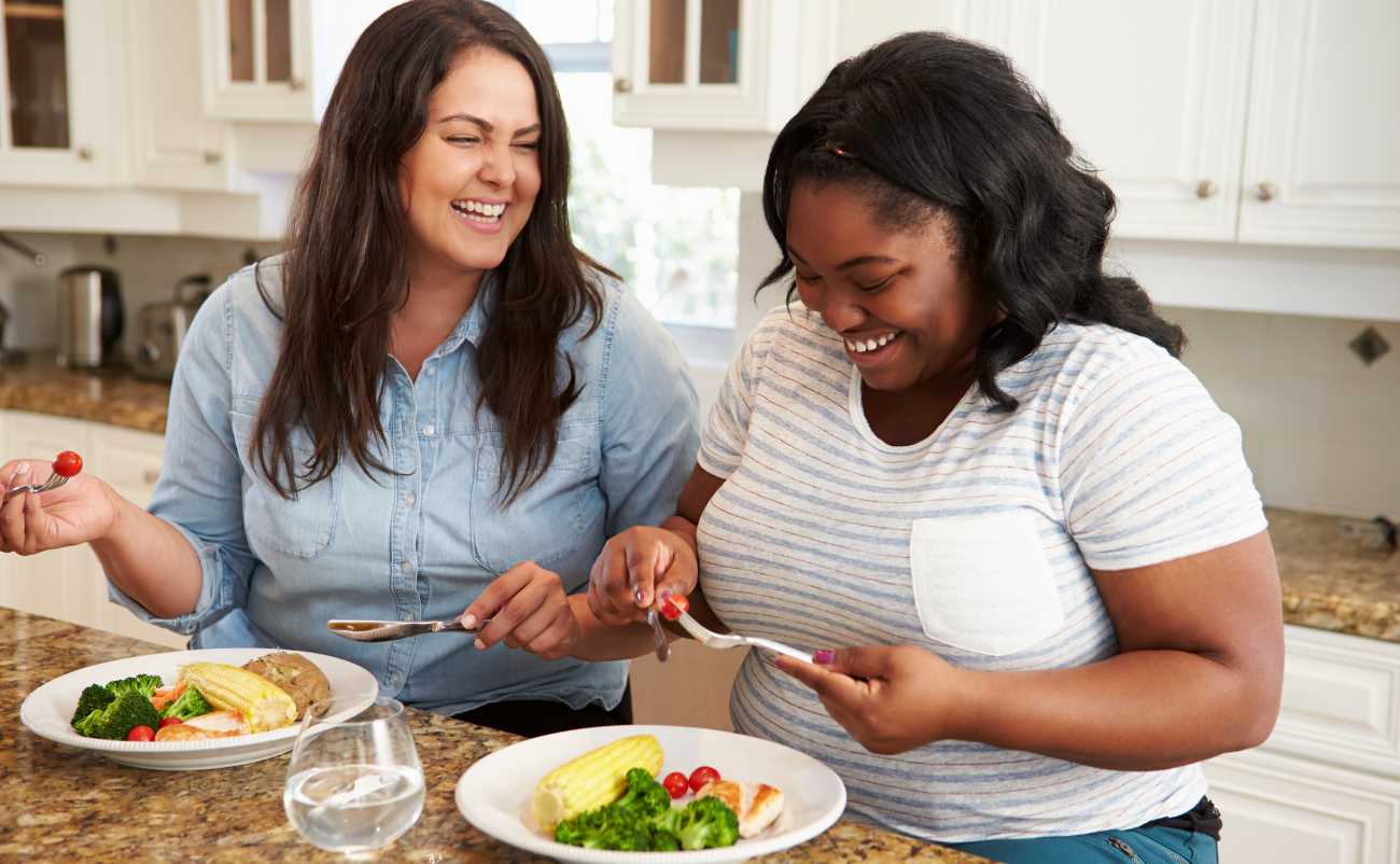 two girls enjoying healthy meal for a healthy lifestyle