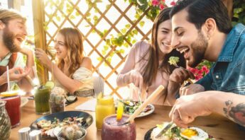 two young couple enjoying mediterranean meal