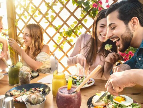 two young couple enjoying mediterranean meal