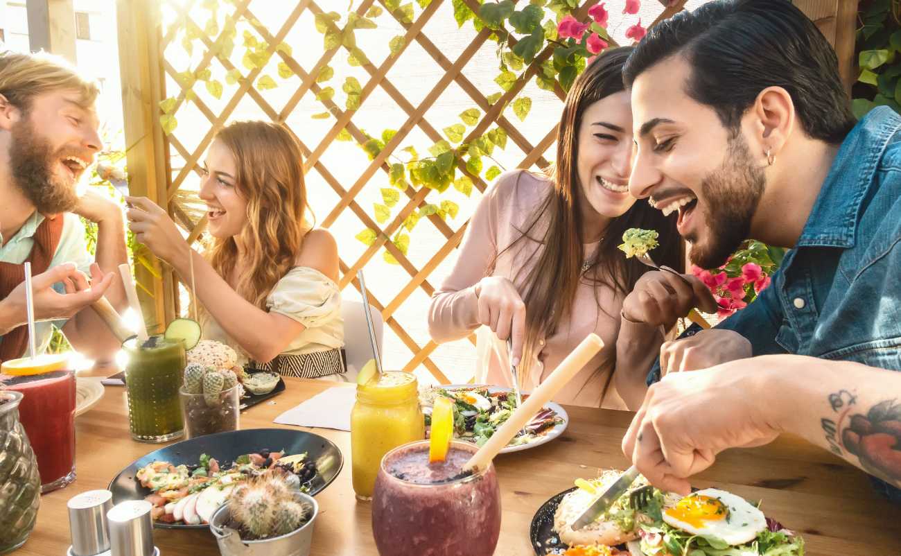 two young couple enjoying mediterranean meal