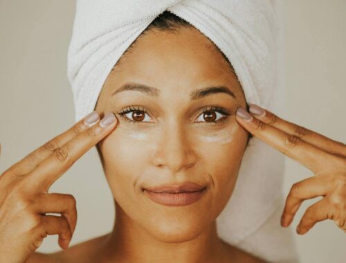 women applying sunscreen to protect skin at home