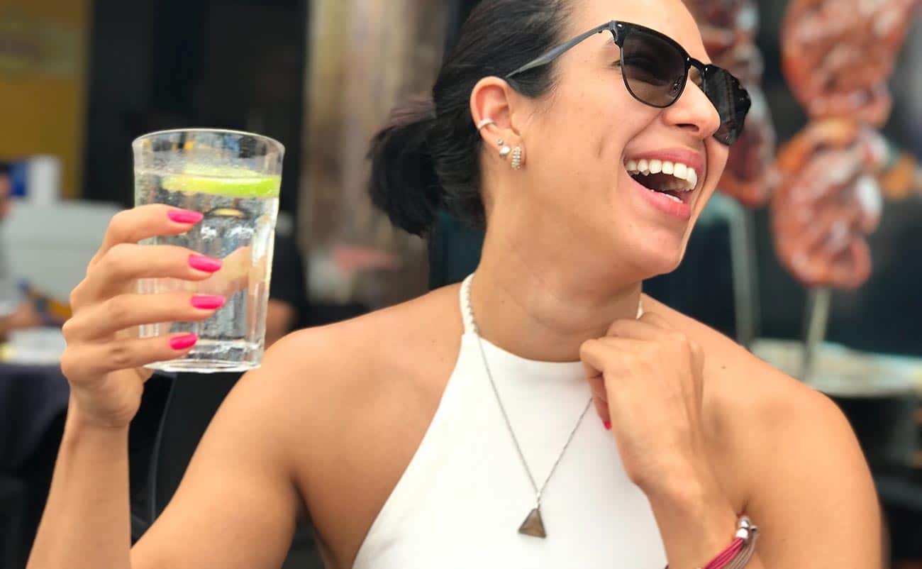 women drinking alkaline water in morning routine at office