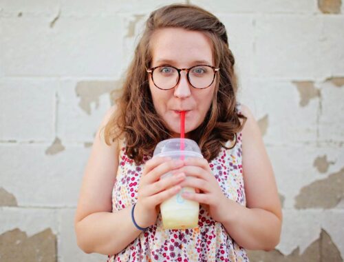 women enjoying smoothies with glasses in pink