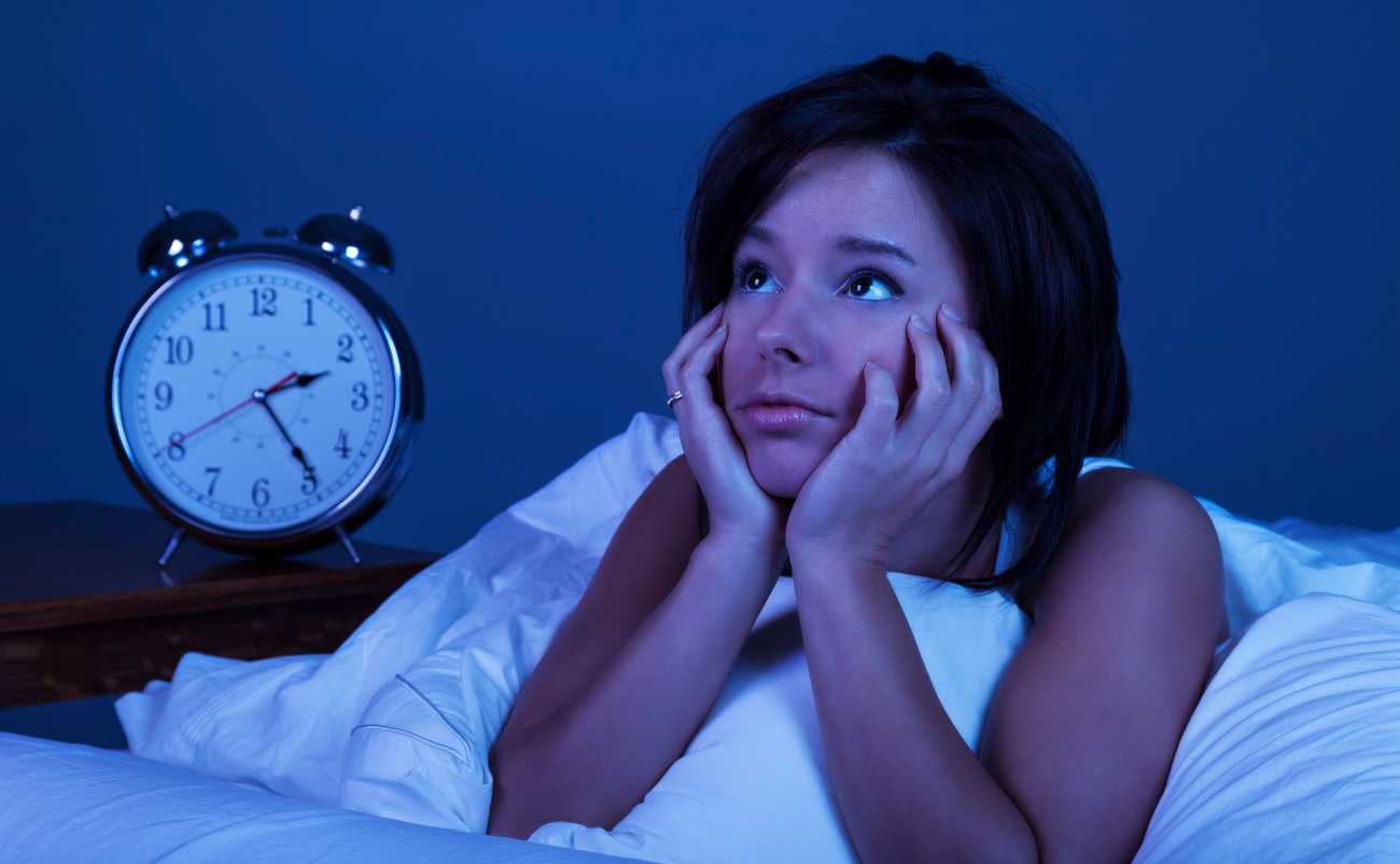 women facing insomnia problem at night 2 am