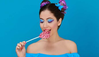 women has sweet tooth leaking heart shape lollipop