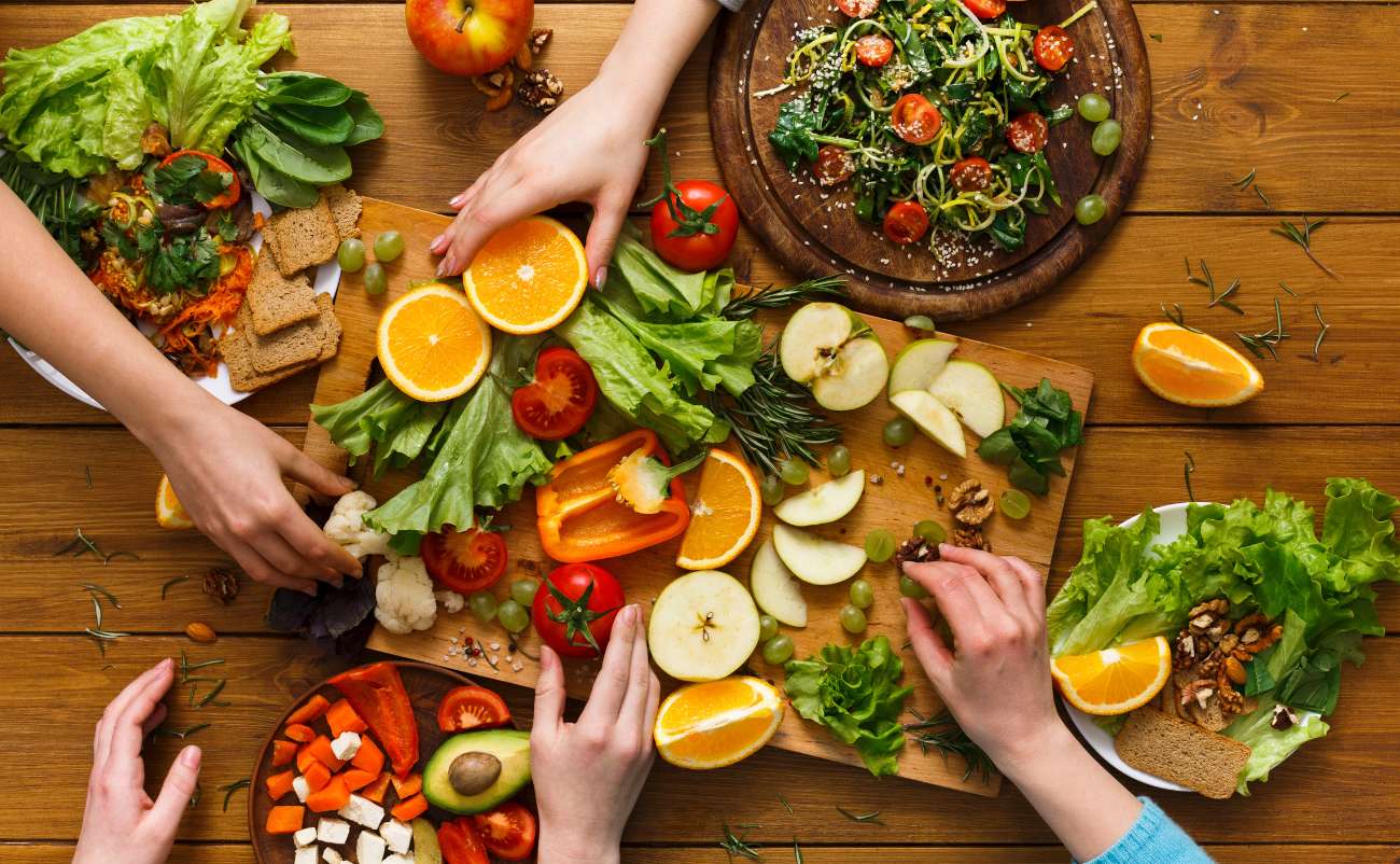 women preparing healthy DASH diet main dishes for family